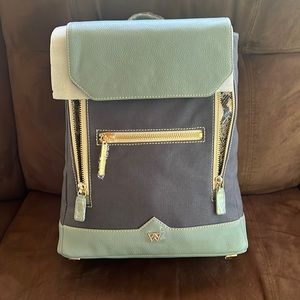Kelly Wynne made in the USA. Brand new back pack purse with dust bag.